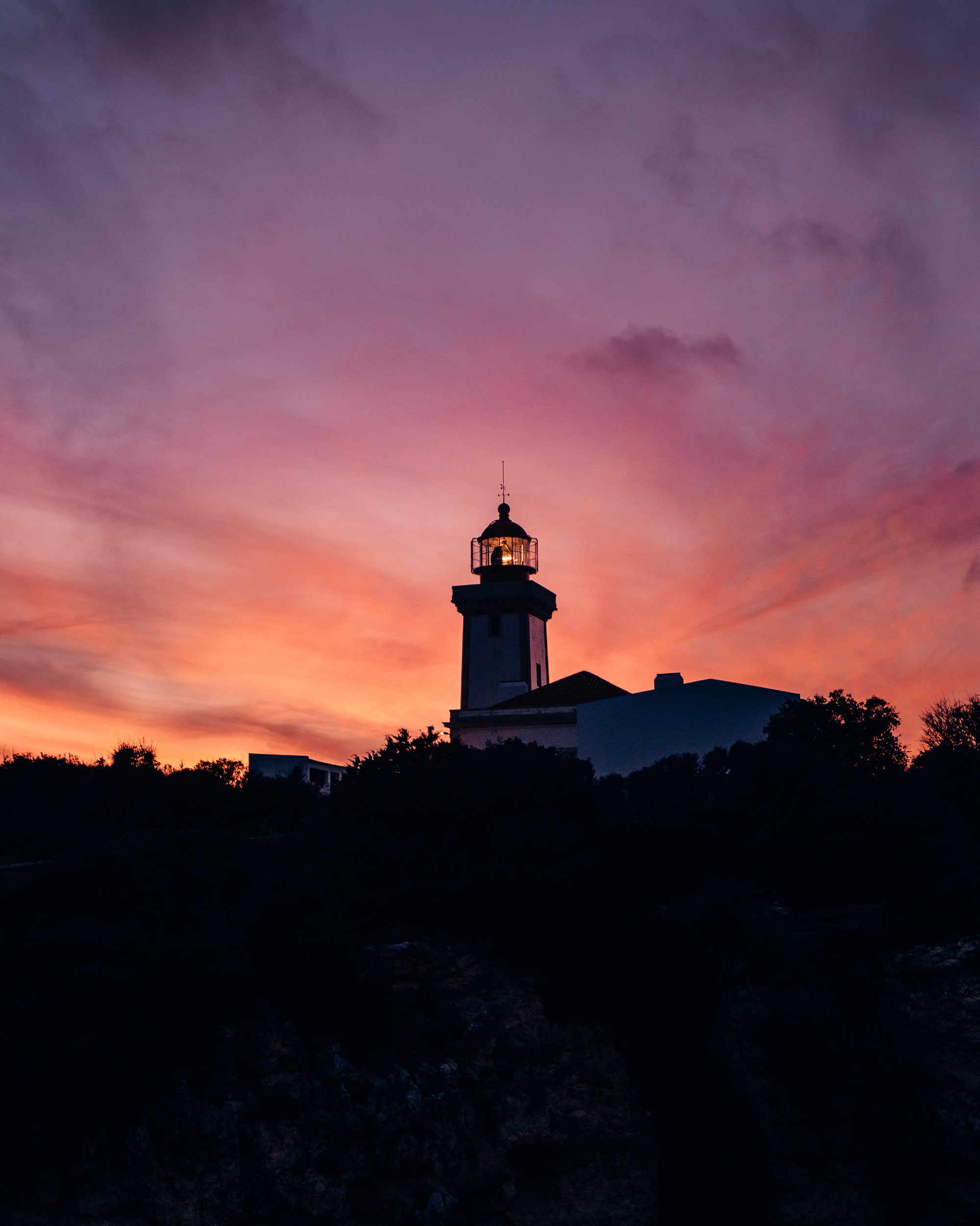 Leuchtturm Farol de Alfanzina Sonnenuntergang Portugal Roadtrip